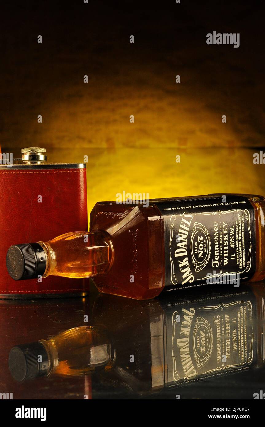 bottle of jack daniels whisky over yellow background Stock Photo Alamy