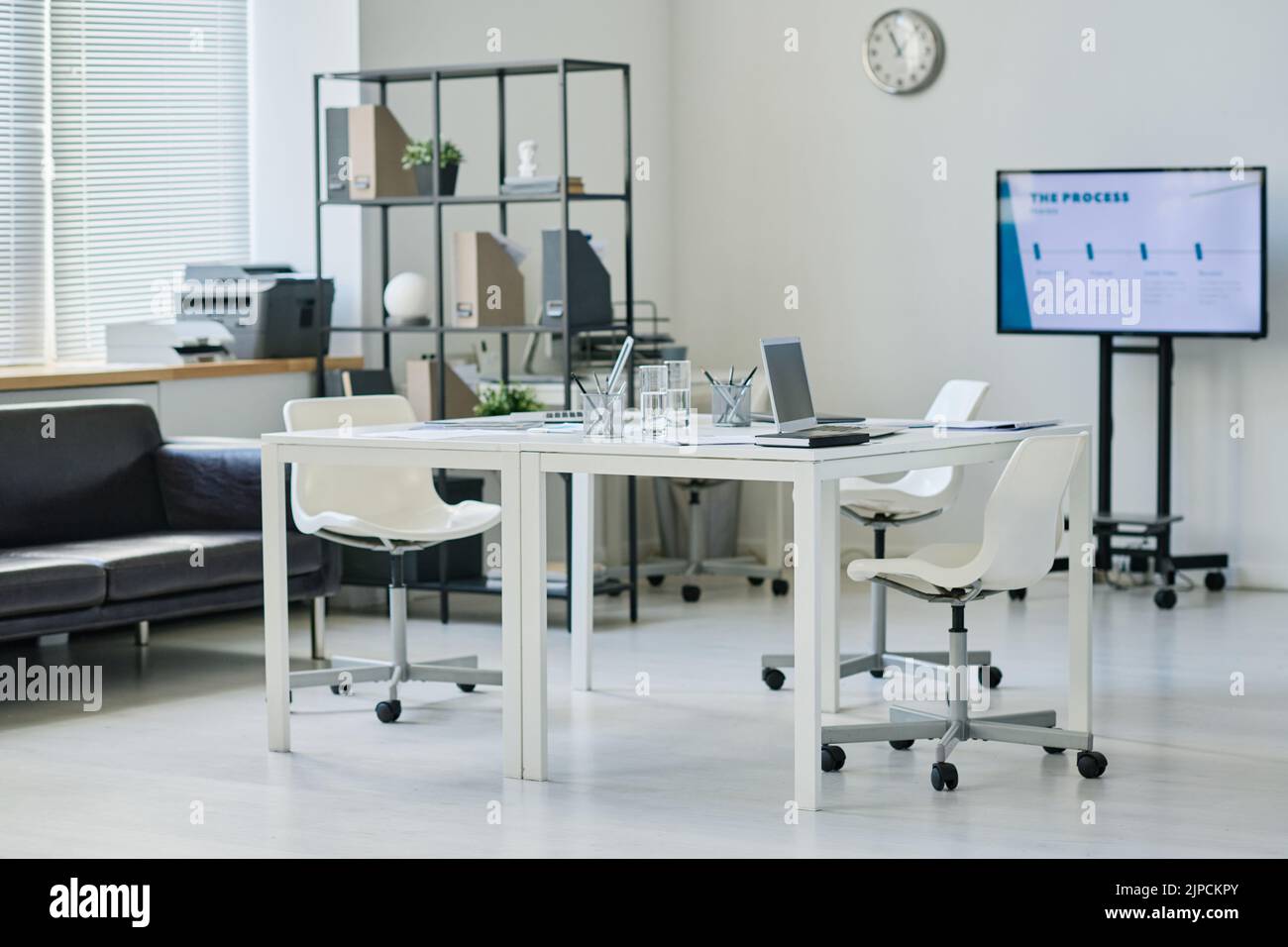 Horizontal image of modern office with table in the middle for business