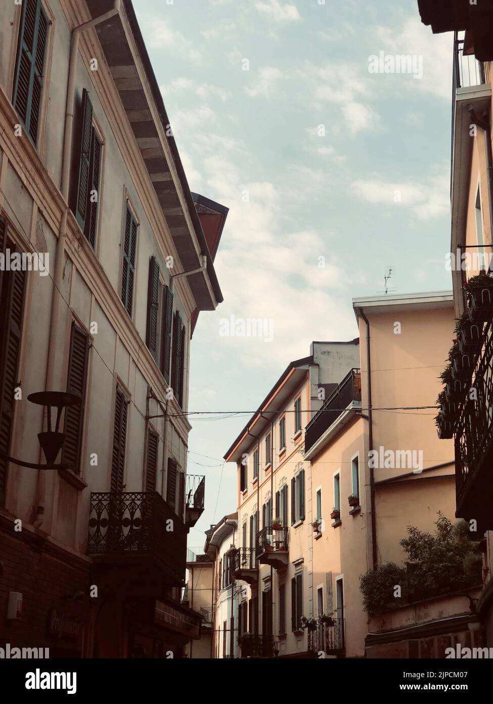 A vertical shot of old buildings in the narrow street Stock Photo - Alamy