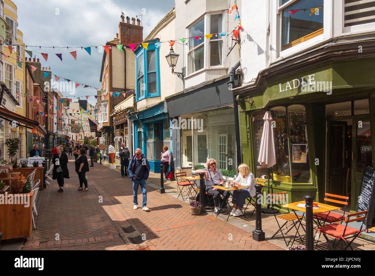 Views along George Street, Hastings Old Town, a vibrant shopping street, East Sussex, UK Stock Photo