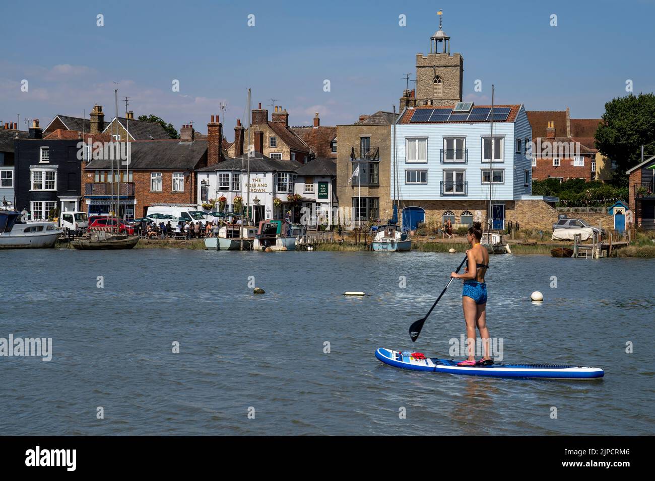 WIVENHOE IN ESSEX, PICTURED FROM THE OPPOSITE SHORE (ROWHEDGE). THE ROSE AND CROWN PUB IS VISIBLE Stock Photo