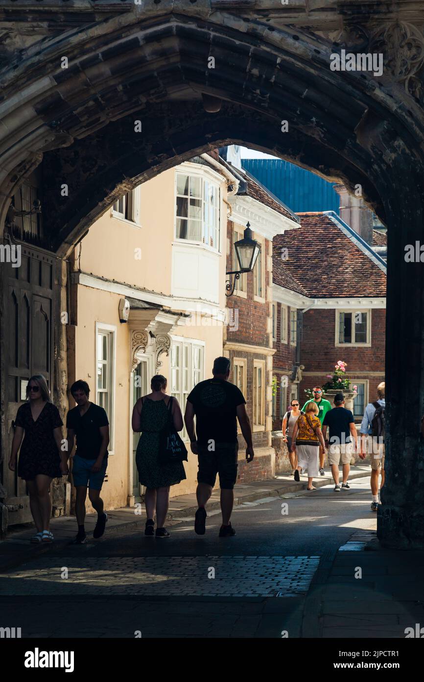 Pedestrians walking through High Street Gate in Salisbury, Wiltshire