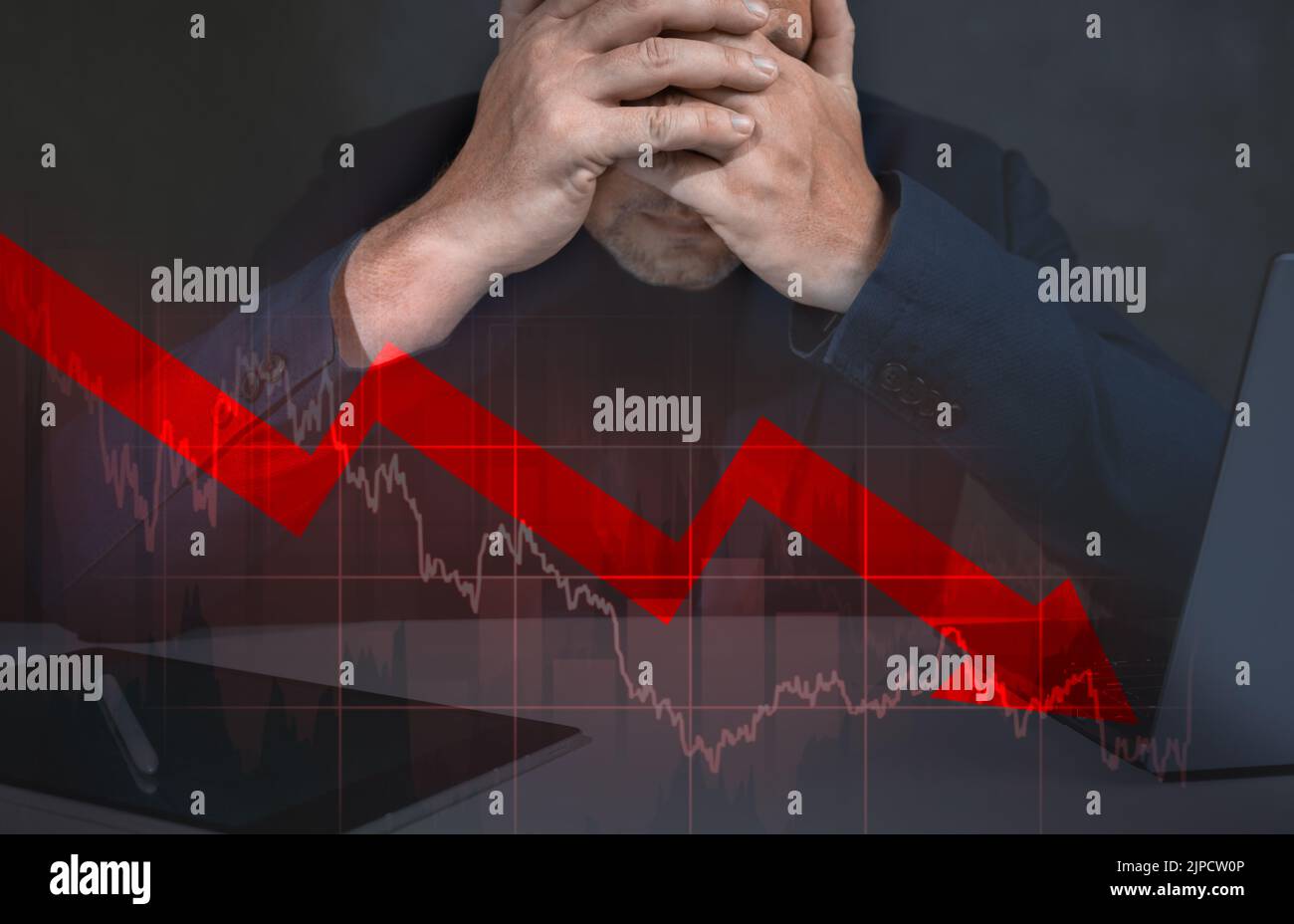 Depressed business man looking down at falling red arrow. Stressed business man crypto trader broker investor analyzing stock exchange market crypto t Stock Photo