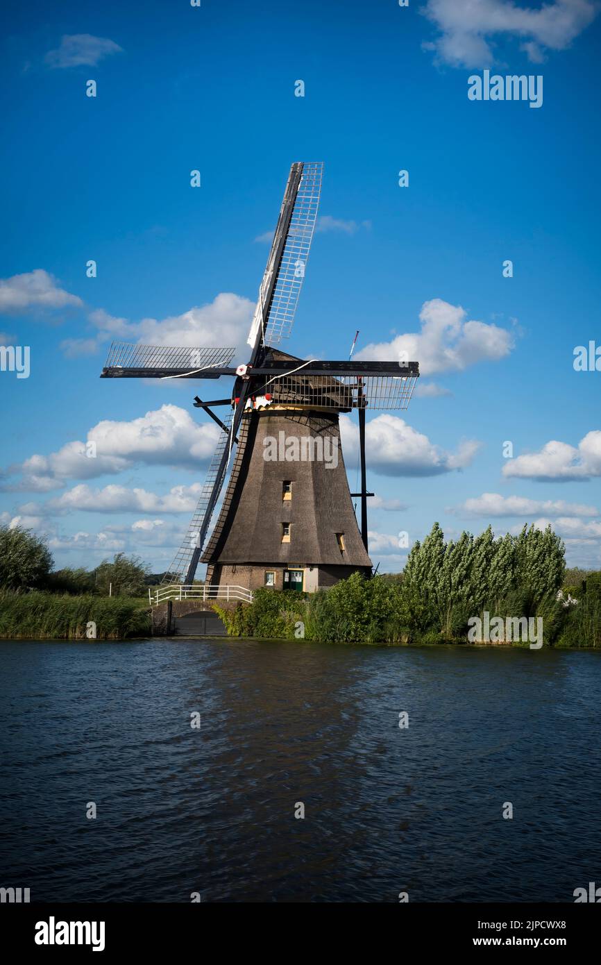 Historic windmill at Kinderdijk in sunshine in the Netherlands Stock Photo