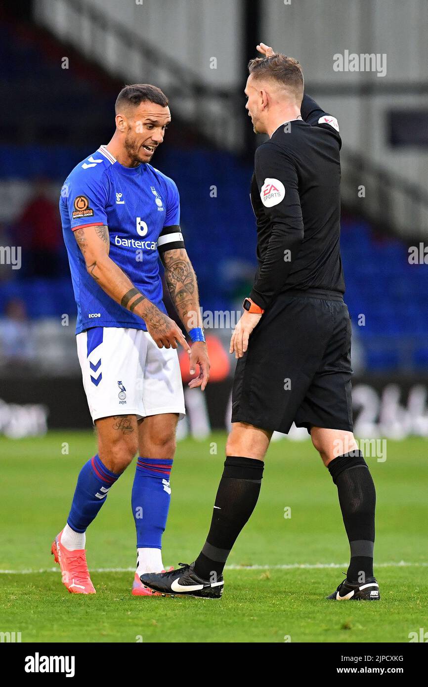 Liam Hogan (Captain) of Oldham Athletic converses with referee Andrew Miller during the Vanarama National League match between Oldham Athletic and Wealdstone at Boundary Park, Oldham on Wednesday 17th August 2022. (Credit: Eddie Garvey | MI News) Credit: MI News & Sport /Alamy Live News Stock Photo