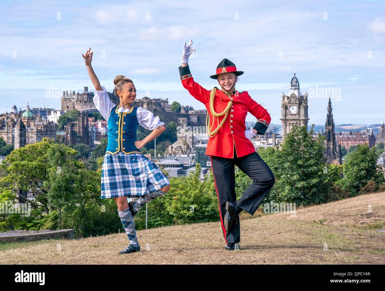 Ellie Wood (left) from the Royal Edinburgh Military Tattoo Dancers teaches some dance moves to Private Aisha Leitner (right) from the New Zealand Army Band as the two groups came together for an impromptu rehearsal, bringing together Maori and Highland cultures on Edinburgh’s Calton Hill. Picture date: Wednesday August 17, 2022. Stock Photo