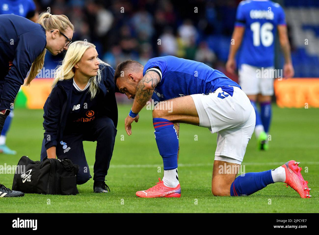 Liam Hogan (Captain) of Oldham Athletic gets treatment during the Vanarama National League match between Oldham Athletic and Wealdstone at Boundary Park, Oldham on Wednesday 17th August 2022. (Credit: Eddie Garvey | MI News) Credit: MI News & Sport /Alamy Live News Stock Photo