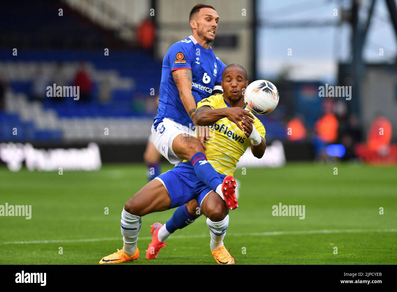 Liam Hogan (Captain) of Oldham Athletic tussles with Rhys Browne of Wealdstone Football Club during the Vanarama National League match between Oldham Athletic and Wealdstone at Boundary Park, Oldham on Wednesday 17th August 2022. (Credit: Eddie Garvey | MI News) Credit: MI News & Sport /Alamy Live News Stock Photo
