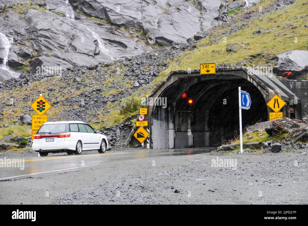 A car waits for the traffic light to turn green as it waits at the one