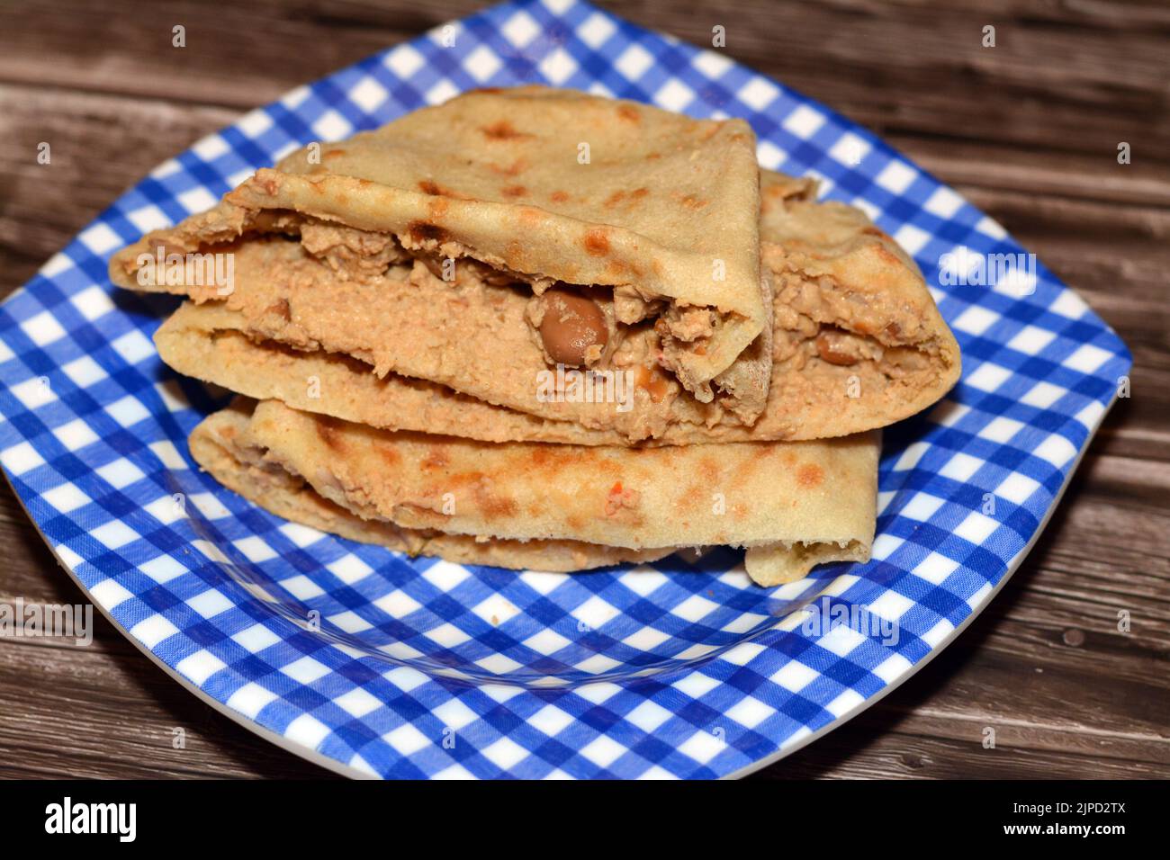 A flat bread with mashed fava beans mixed with oil, sesame tahini