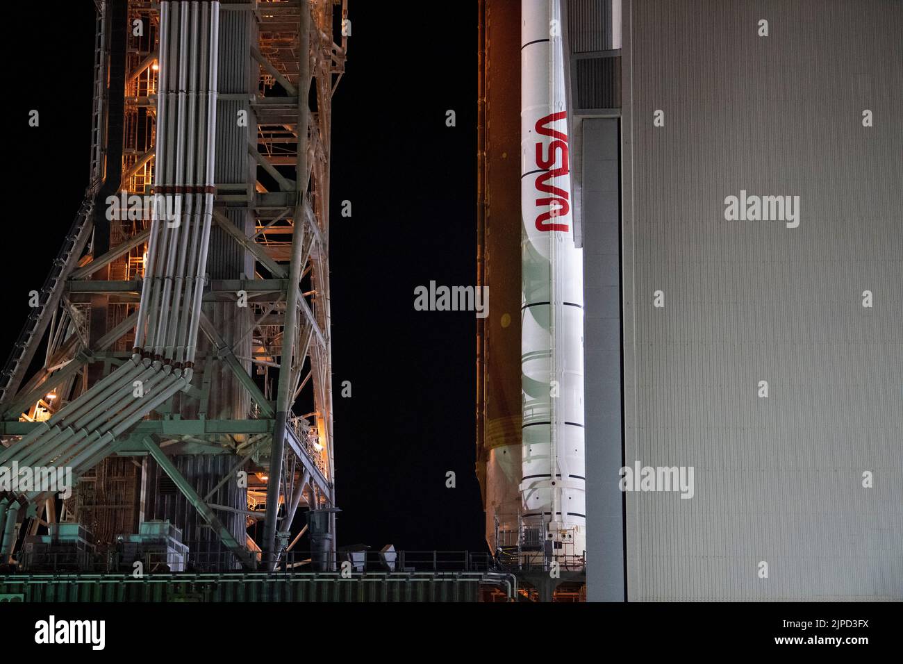 NASAs Space Launch System (SLS) rocket with the Orion spacecraft aboard is seen atop a mobile launcher as it rolls out of the Vehicle Assembly Building to Launch Complex 39B, Tuesday, Aug. 16, 2022, at NASAs Kennedy Space Center in Florida. NASAs Artemis I mission is the first integrated test of the agencys deep space exploration systems: the Orion spacecraft, SLS rocket, and supporting ground systems. Launch of the uncrewed flight test is targeted for no earlier than Aug. 29, 2022. Mandatory Credit: Joel Kowsky/NASA via CNP Stock Photo