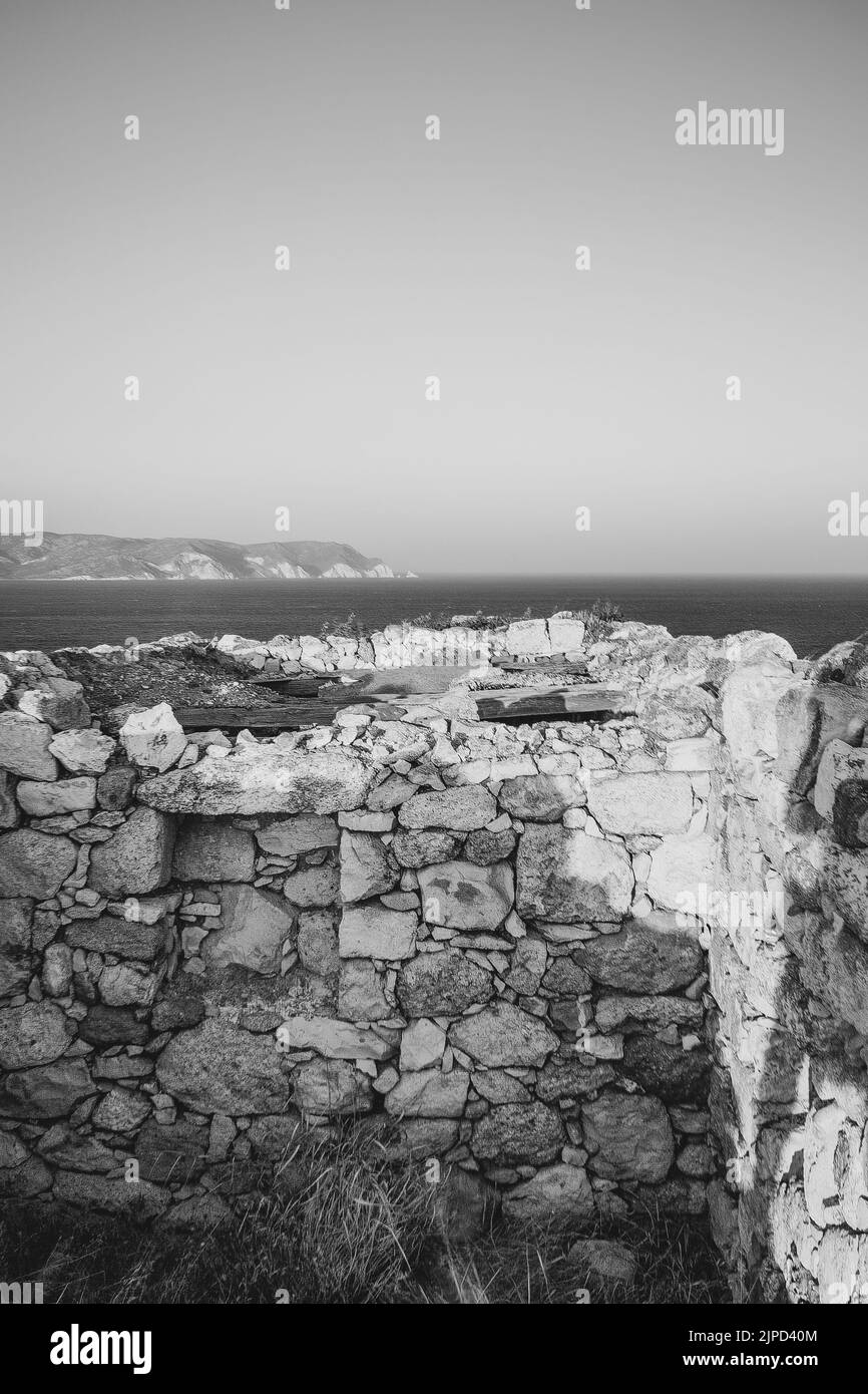 Abandoned house on the coast of Milos Island, Cyclades, Greece Stock