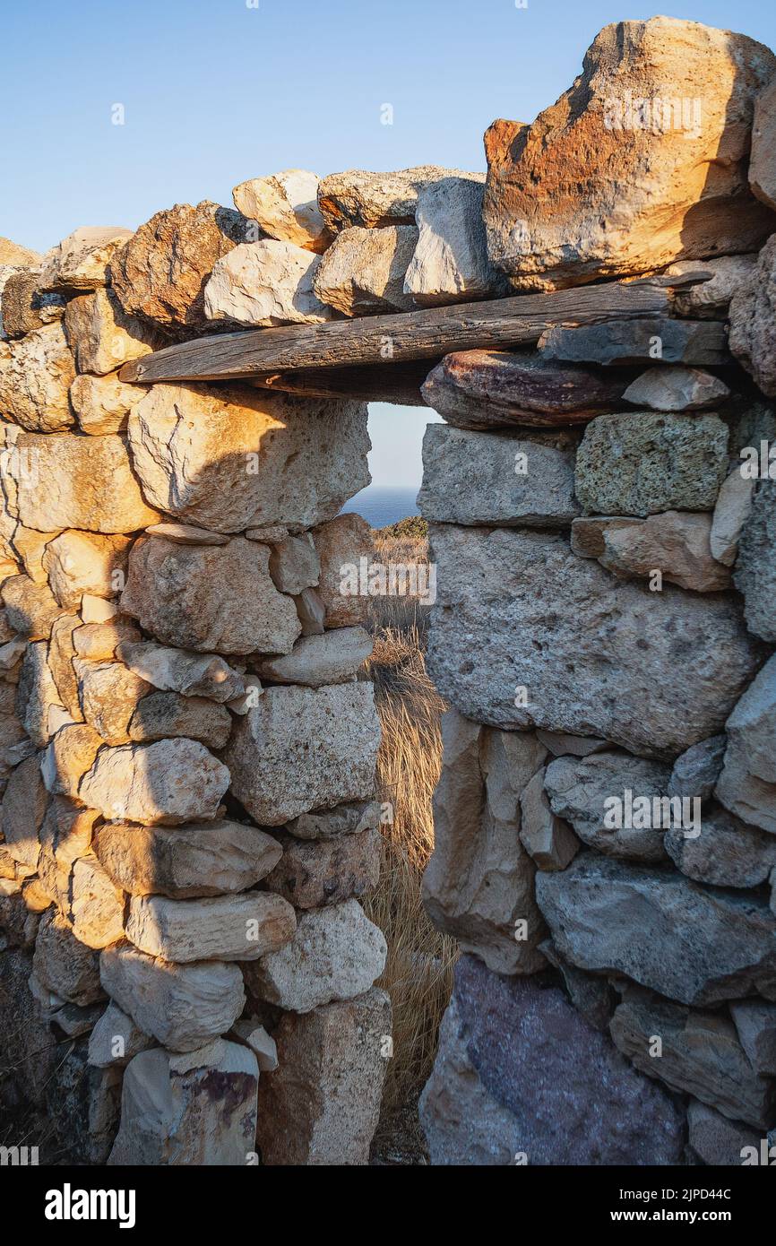 Abandoned house on the coast of Milos Island, Cyclades, Greece Stock