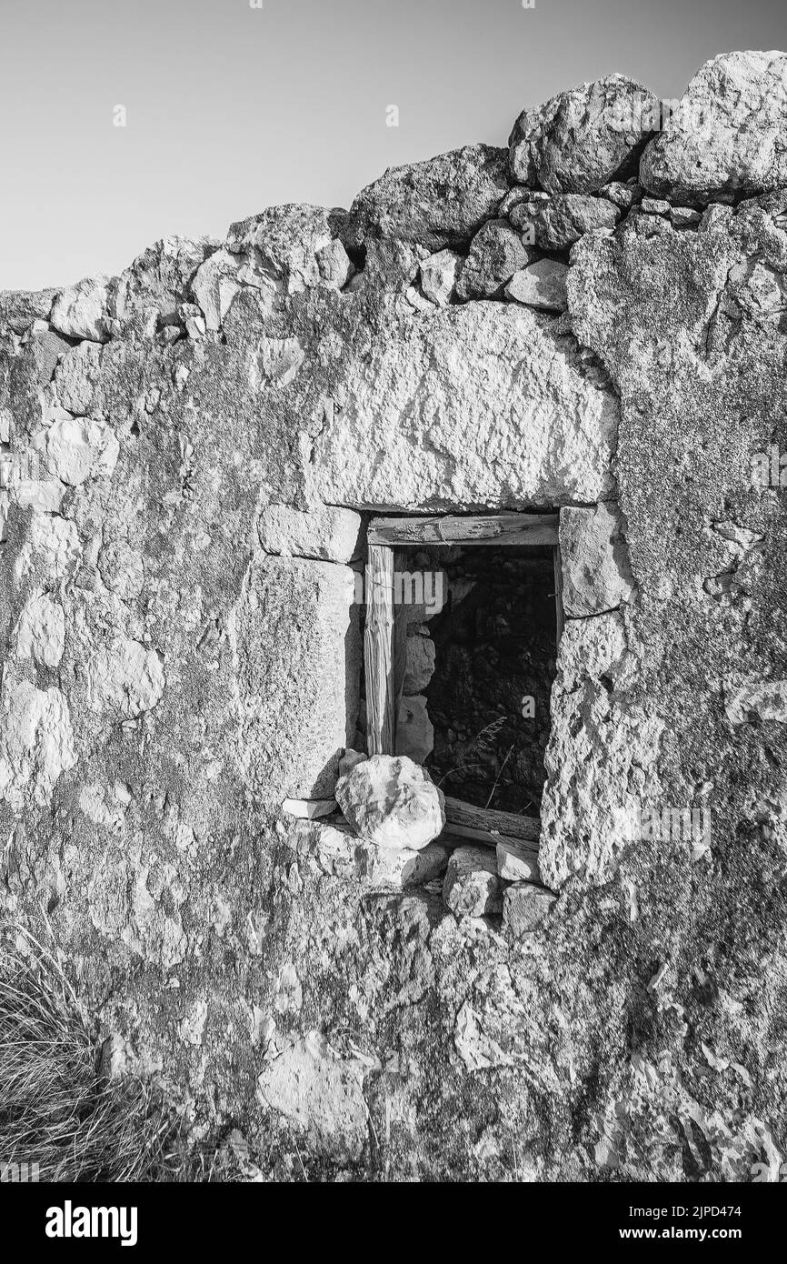 Abandoned house on the coast of Milos Island, Cyclades, Greece Stock