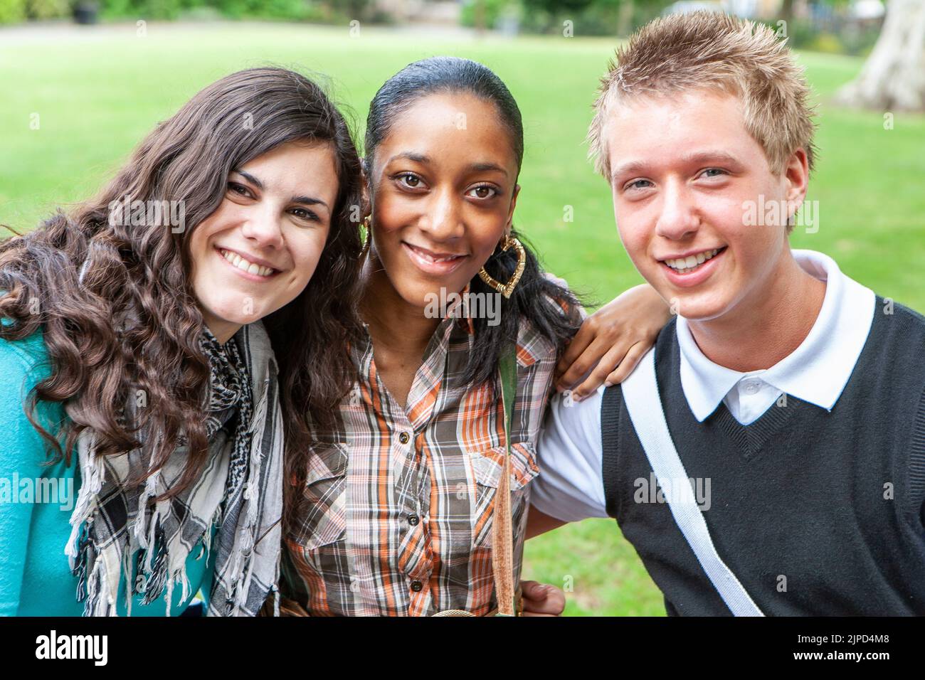 Teenage Students, school friends. Portrait of teenage school friends during a break from class. From a series of related images. Stock Photo