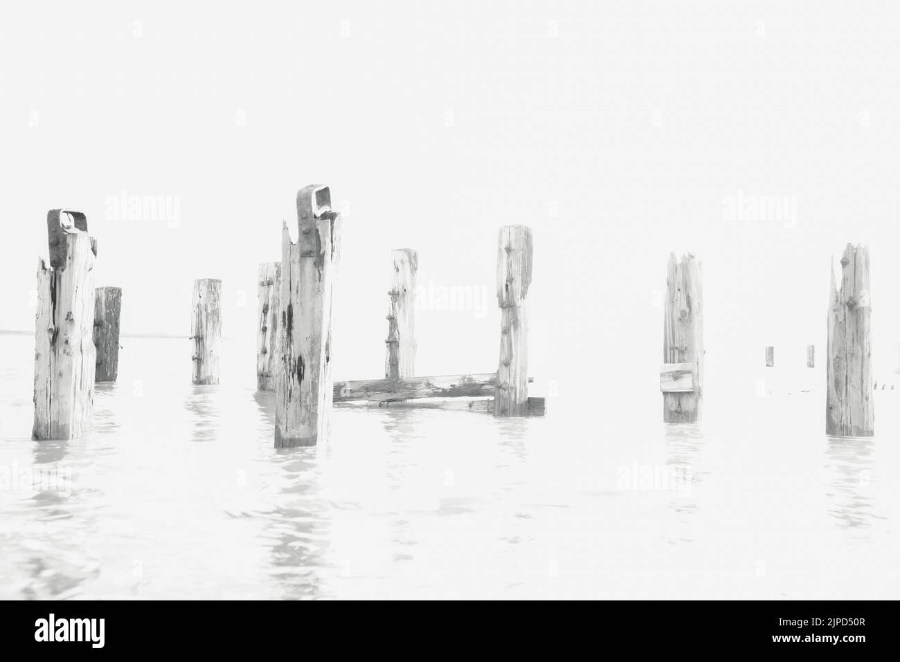 Old wooden groynes in the atlantic, at Crow Point, Devon UK Stock Photo