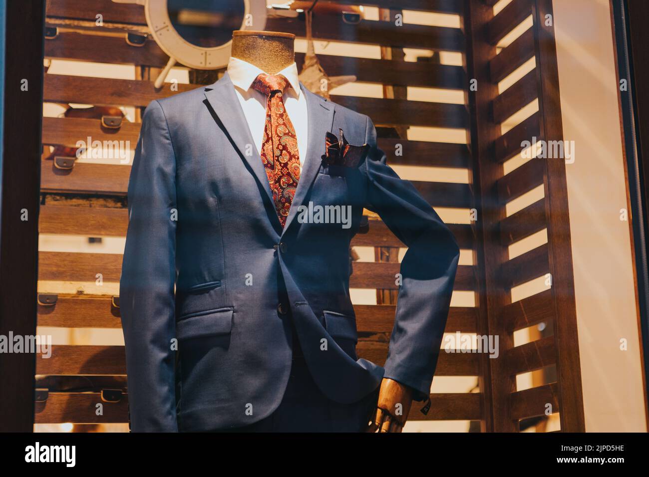 A closeup of a blue tuxedo with a red tie on a mannequin Stock Photo ...