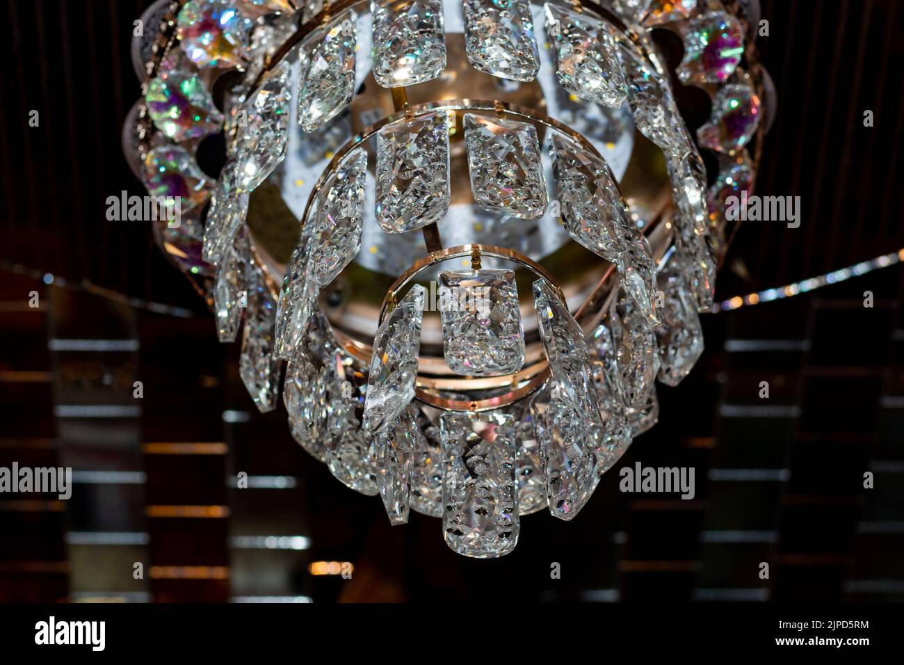 Chandeliers cage chandeliers feature a light source surrounded by metal, wire, or other cages. Stock Photo