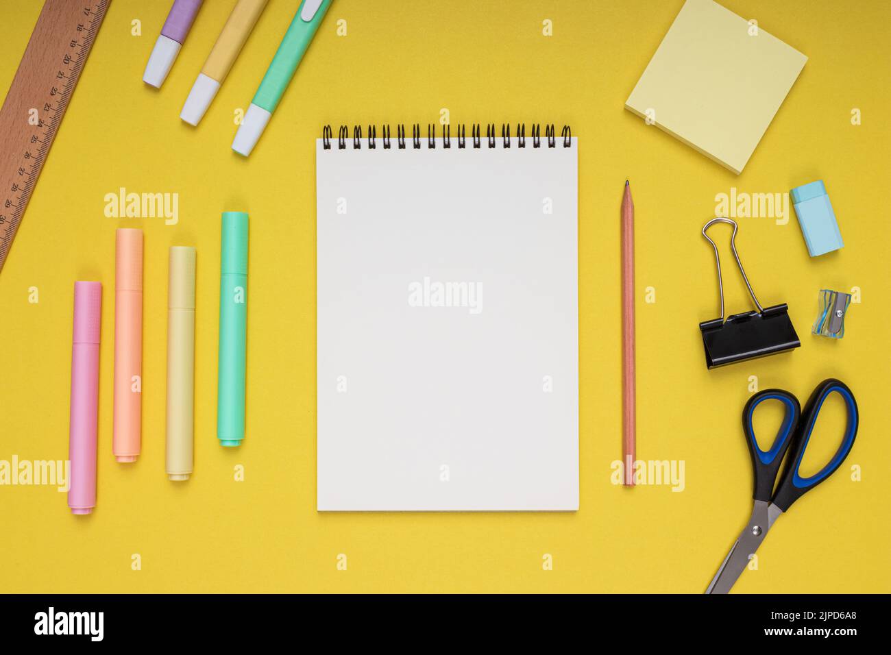 notepad, scissors, pencil, sharpener, ruler, eraser, colored pencils ...
