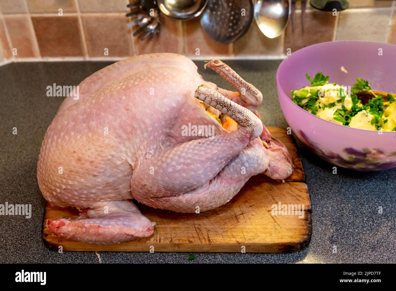 A Large Fresh Turkey and Bowl Of Traditional Herb and Butter Stuffing