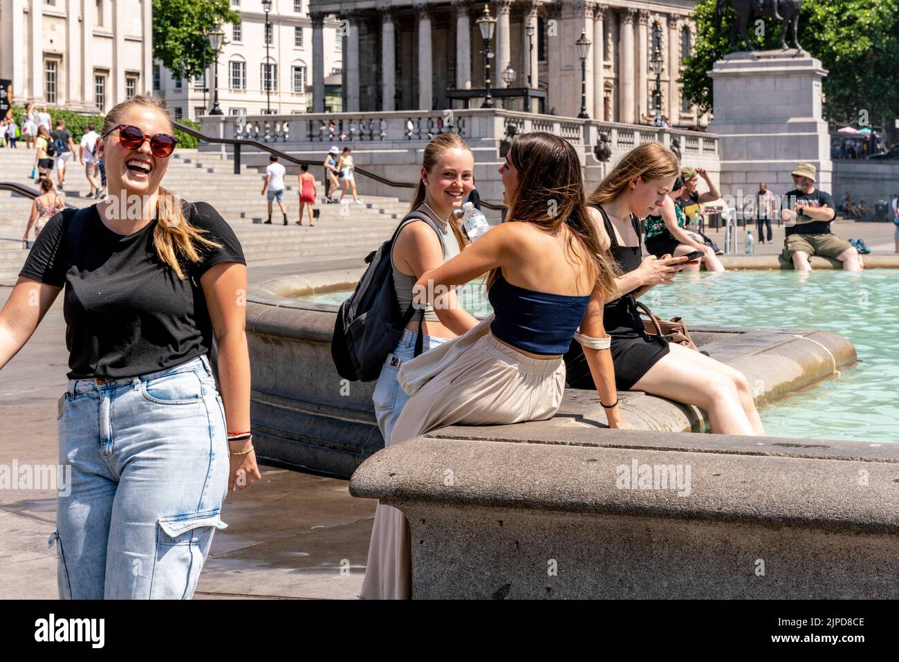 A Group Of Young People Cool Off In The Fountains In Trafalgar Square During The Hottest Day Ever Recorded In The Capital, London, UK. Stock Photo