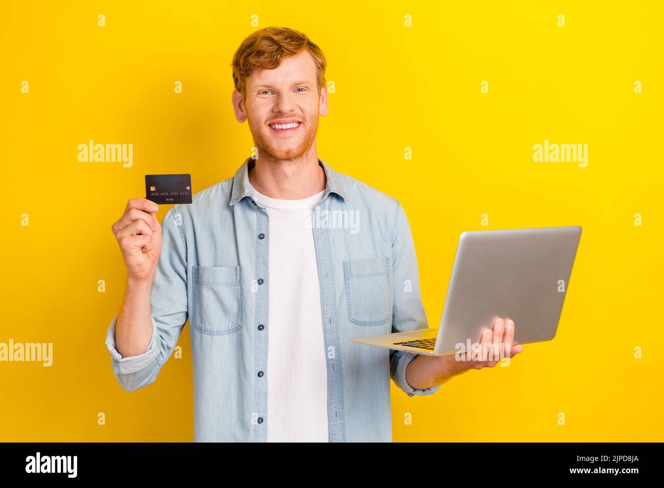 Photo of positive rich man hand arm hold netbook credit card offer use ...
