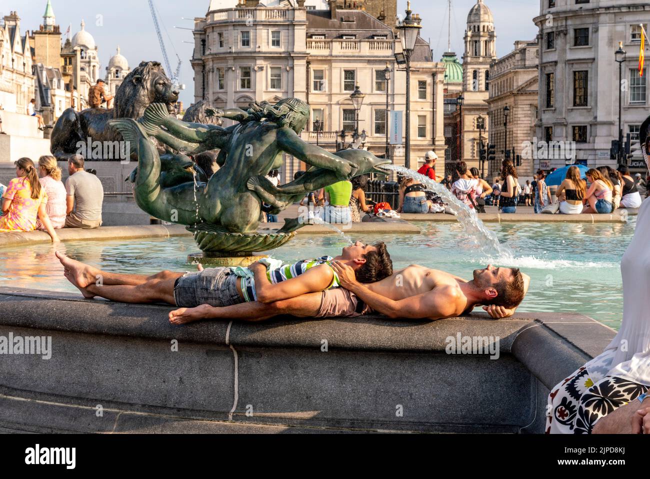 Young People Cool Off By The Water Fountains In Trafalgar Square During The Hottest Day Ever Recorded In The Capital, London, UK. Stock Photo