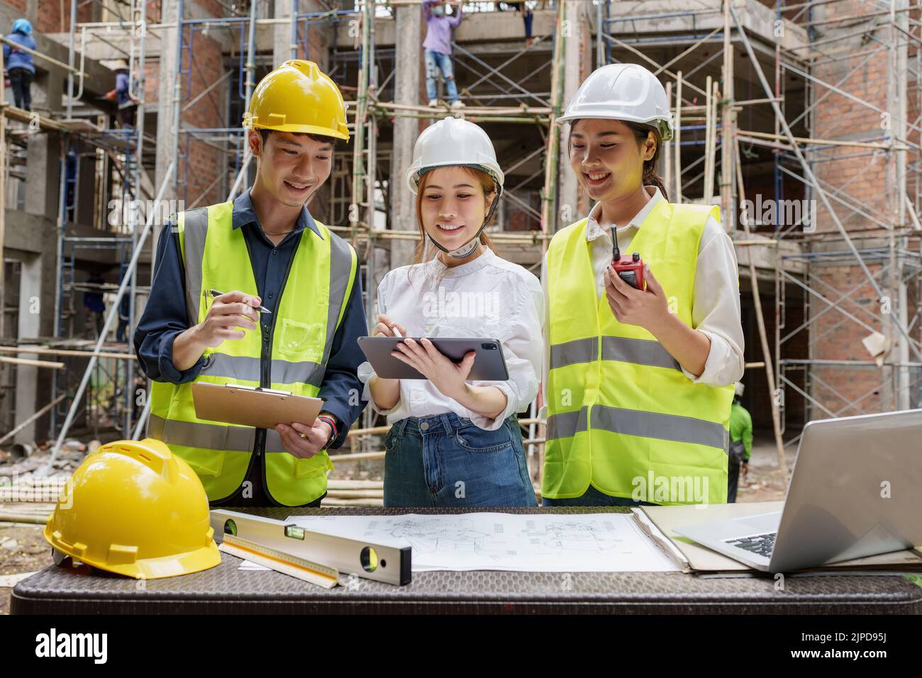 Structural Engineer At Work Structural engineer and architect discussing and working with ...