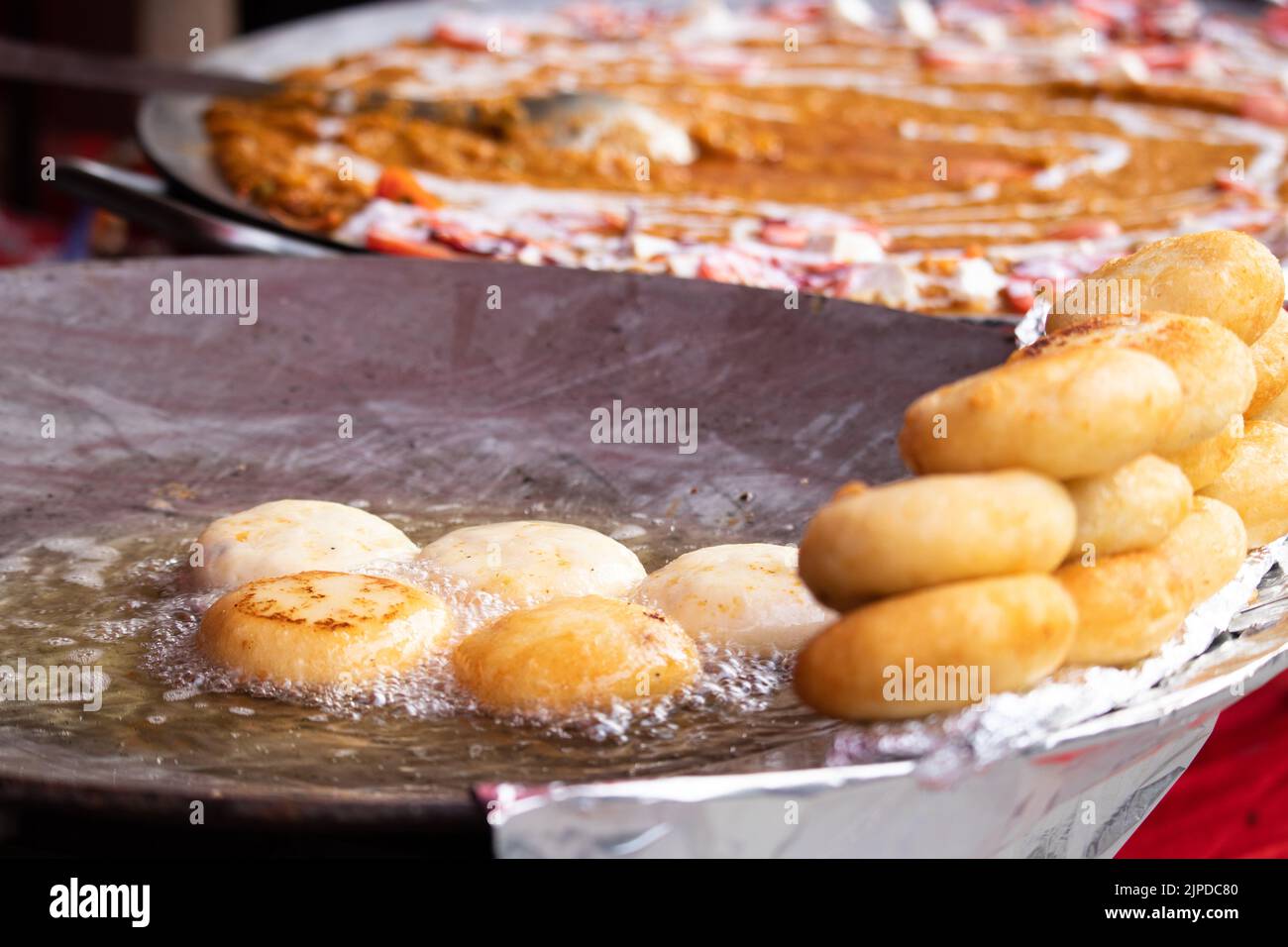 Deep Frying Favorite Indian Street Food Aloo Chaat Tiki Chat Or Alu Chaat Tikki Made Of Boiled And Mashed Potato In Hot Boiling Refined Oil On Large T Stock Photo