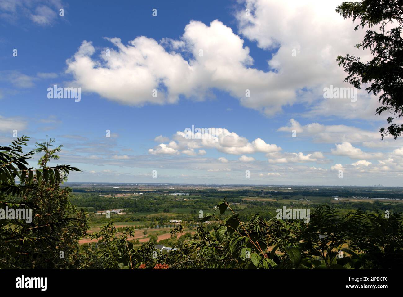 A view of Milton, Ontario with landscaped pond, green grass meadows, from Mount Nemo Conservation Area Stock Photo