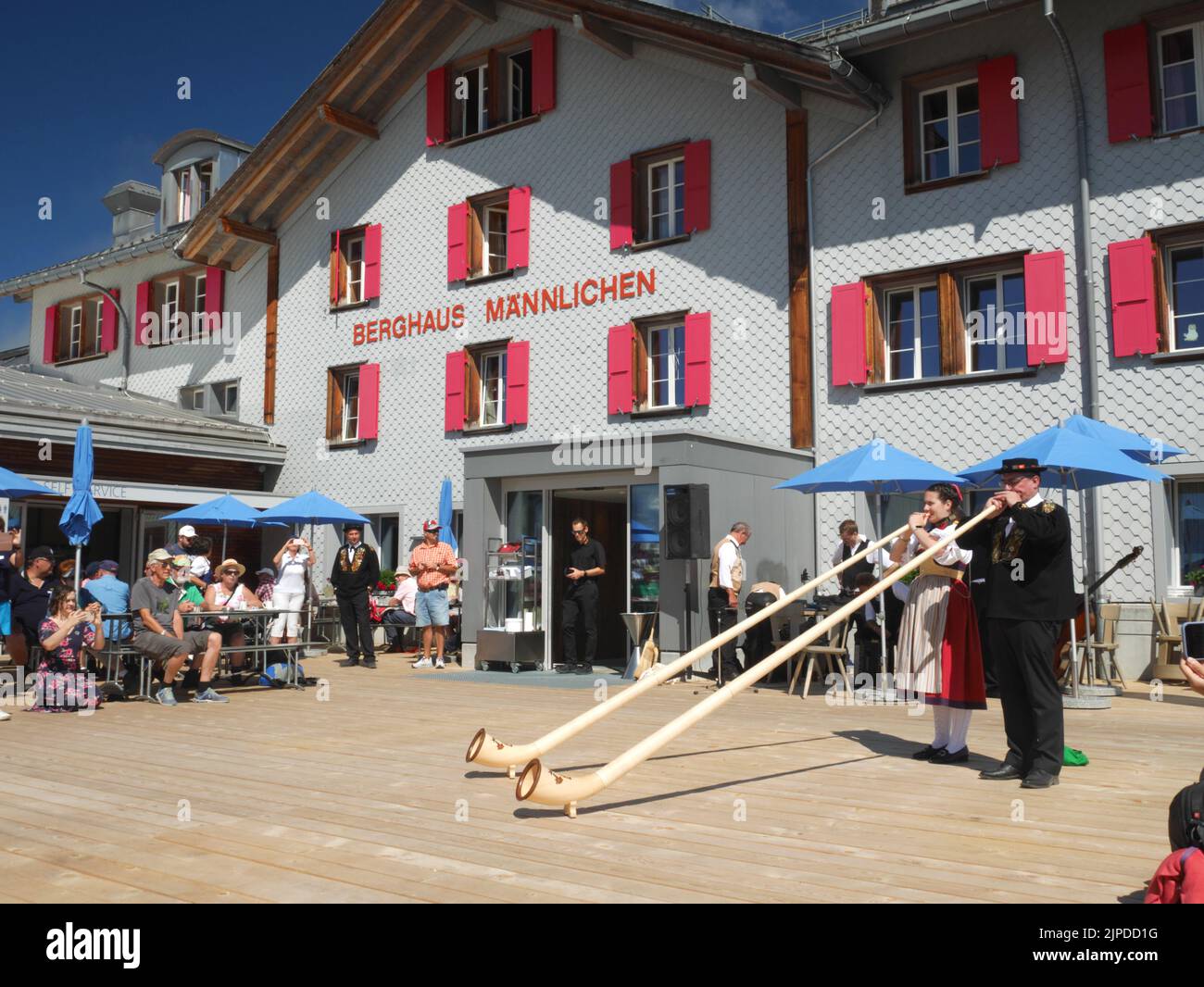 Swiss alpenhorn players, Mannlichen, Wengen, Bernese Oberland, Switzerland. Stock Photo