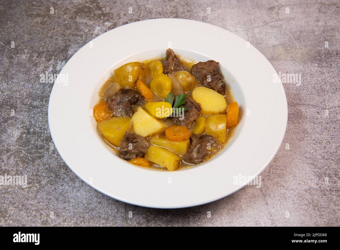 Recipe for beer and mustard beef chuck stew with potatoes, turnips and