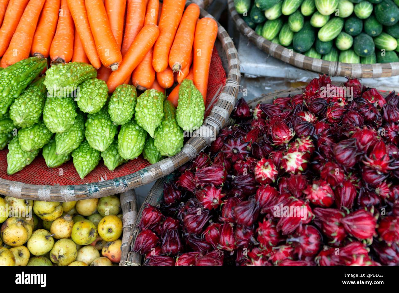 Selection of asian fruits and vegetables in the market in Vietnam Stock Photo