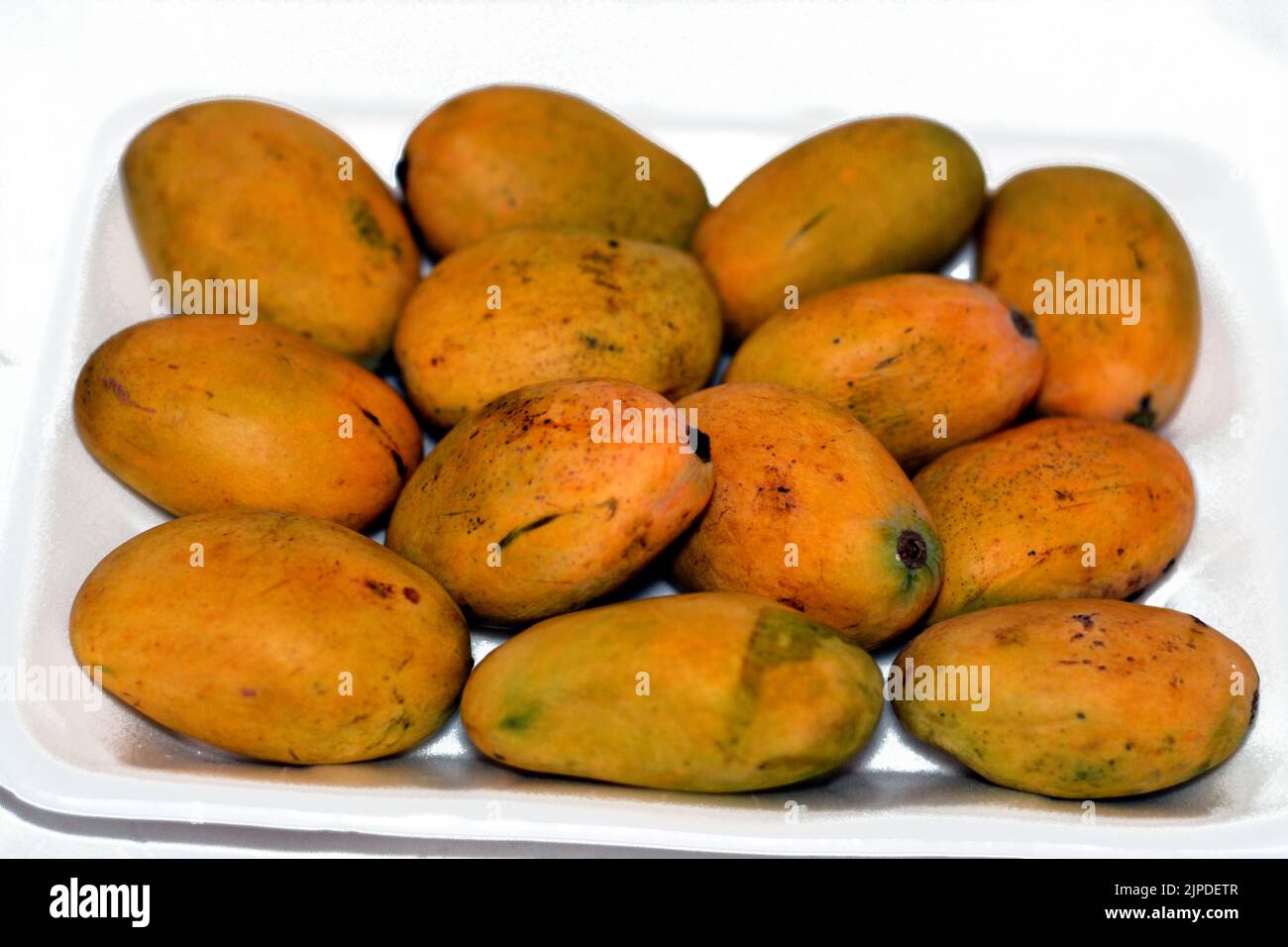 fresh Mango fruit isolated on a white background, a mango is an edible