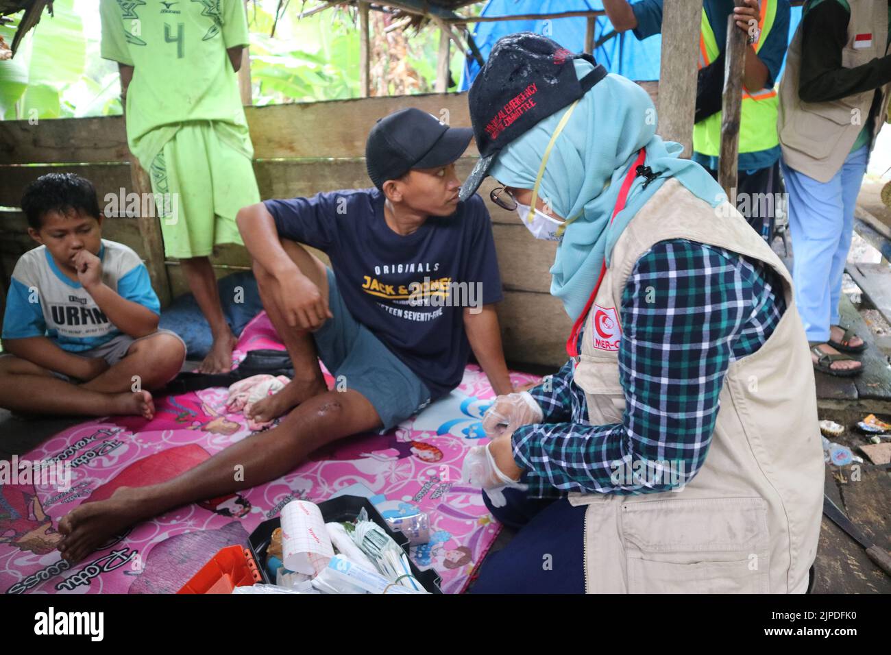 Health workers who are treating patients in the field Stock Photo