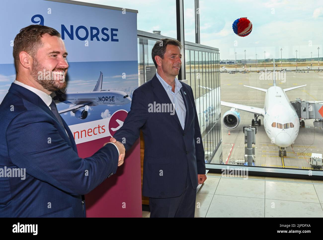 17 August 2022, Brandenburg, Schönefeld: Thomas Hoff Andersson (l), Managing Director for Airport Operations at BER, and Björn Tore Larsen, CEO of Norse Atlantic Airways, stand in front of a Boeing 787 Dreamliner ahead of the first flight from the capital's airport BER to New York (JFK). The airline Norse Atlantic Airways will launch its first flight from BER Airport to New York (JFK) on August 17. Photo: Patrick Pleul/dpa Stock Photo