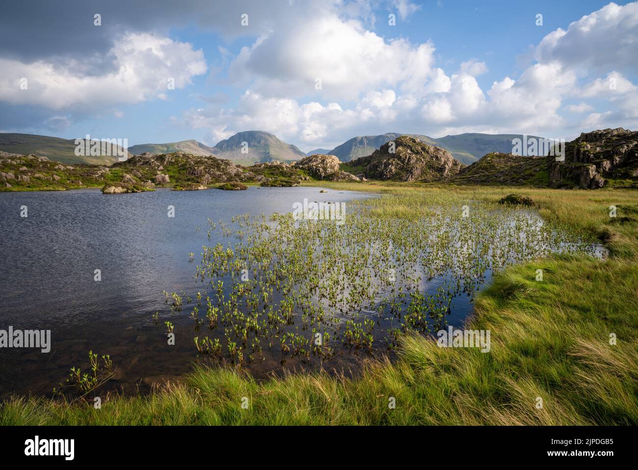 View of Innominate Tarn overlooked by Green Gable and Great Gable, mountains in the lake district, Cumbria Stock Photo