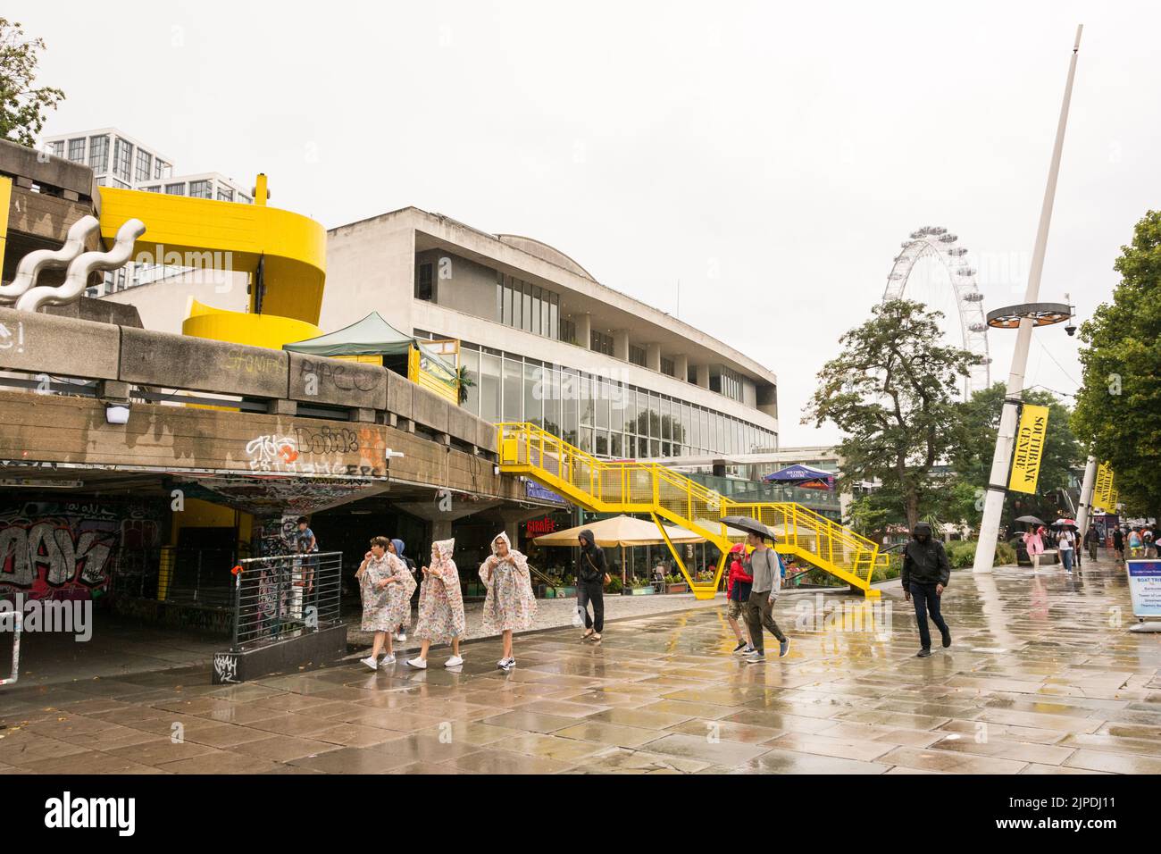 The drought and heatwave in the UK is finally over - tourists enjoying cooler weather and some rain at London's Southbank Centre, London, England, UK Stock Photo