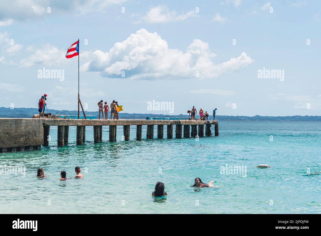 Aguadilla, Puerto Rico - August 26, 2021: Beautiful Pier Located in Crash Boat Beach Puerto Rico. Stock Photo