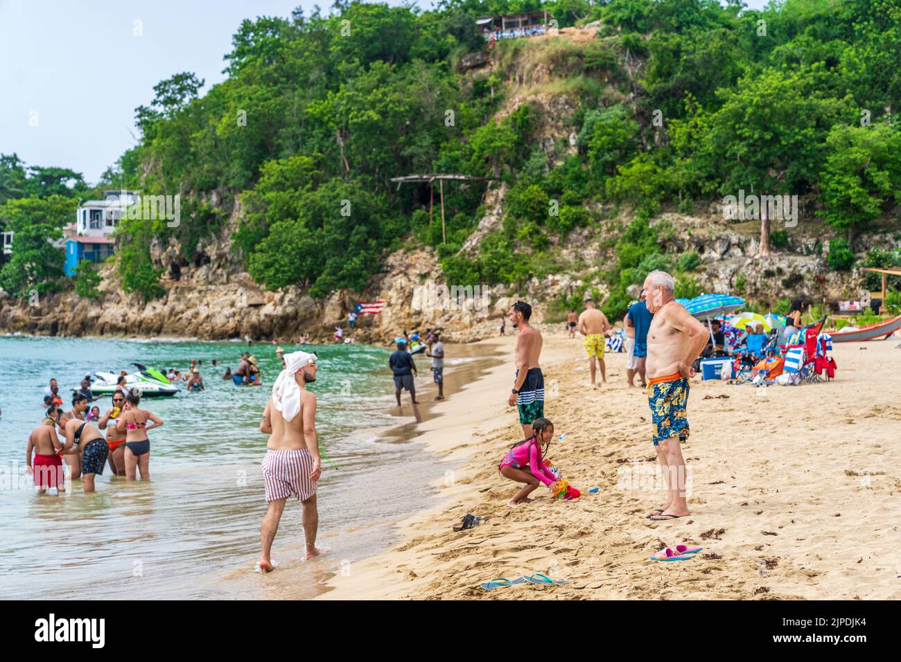 Aguadilla, Puerto Rico - August 27, 2021: Beachgoers Enjoying the Beautiful Waters of Crash Boat Beach. Stock Photo