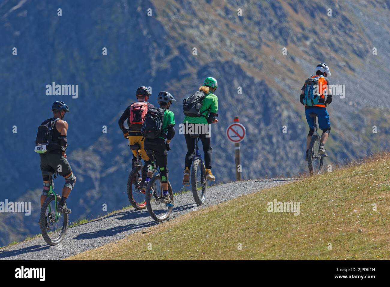 CHAMROUSSE, FRANCE, August 1, 2022 : A group of unicycle practitioners train on the paths of the Croix de Chamrousse. Stock Photo