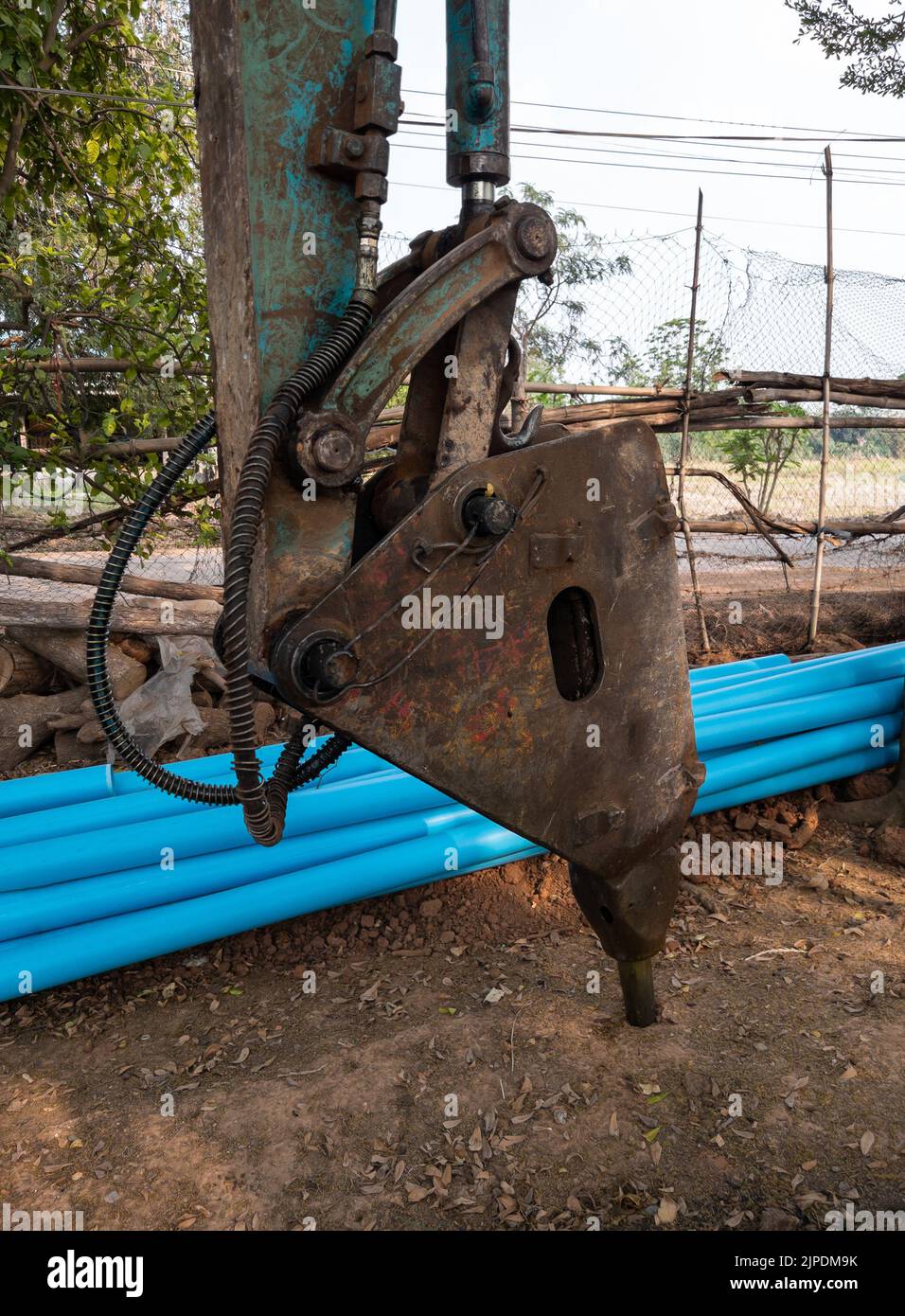 Closeup of the jackhammer and the drilling vehicle to drilling roads