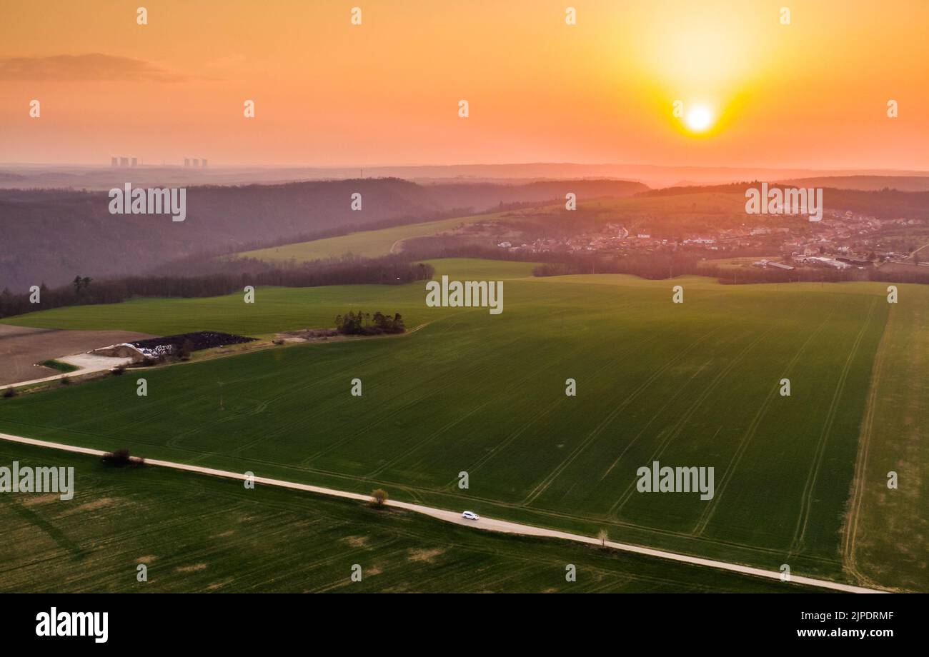 Aerial view of agriculture land during beautiful sunset. Fields and