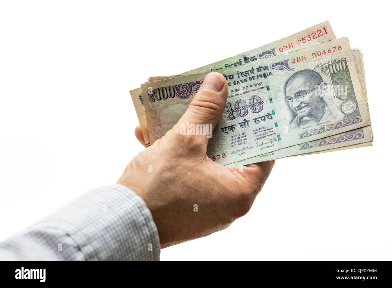 Indian rupees, bundle of money, held in hand on a light background Stock Photo