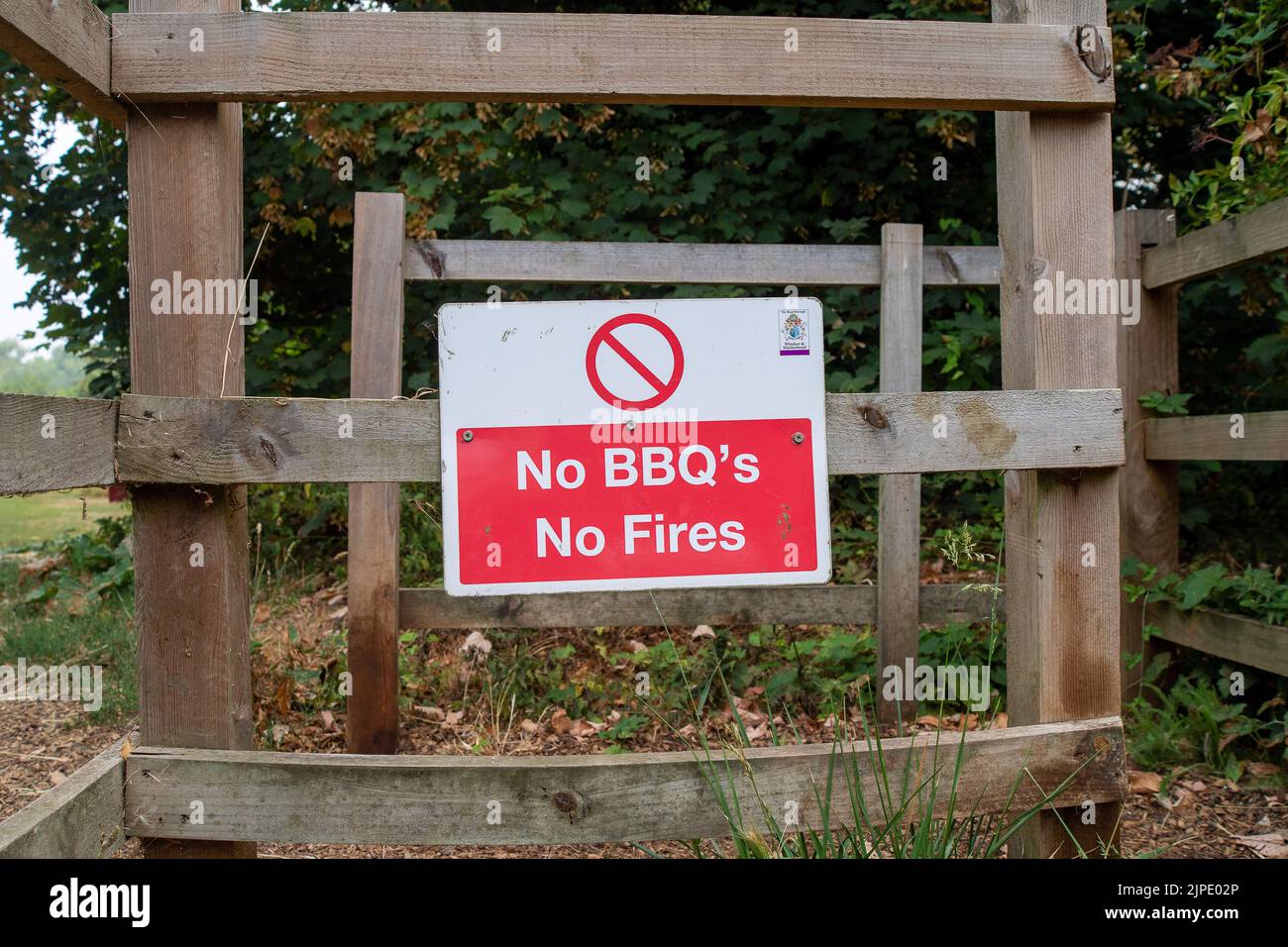 Windsor, Berkshire, UK. 17th August, 2022. A reminder in a park in Windsor not to light barbecues or fires. A number of the field fires across the UK since the heatwave are reported to have been as a result of using disposable BBQs.A petition to ban both the the sale and use of disposable BBQs has reached over 25,000 signatures. Credit: Maureen McLean/Alamy Live News Stock Photo