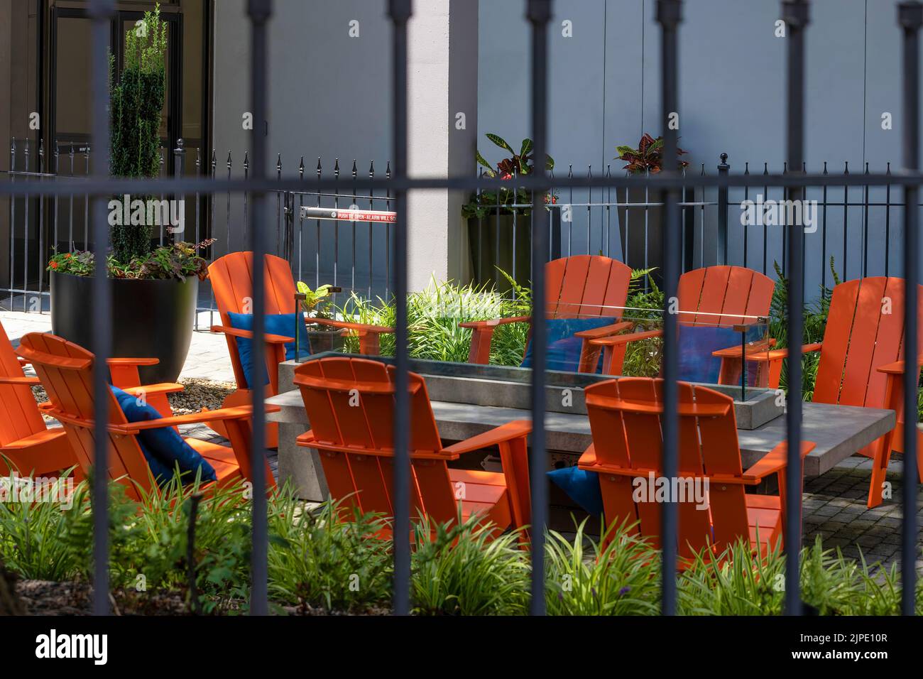 Colorful and inviting outdoor seating in a courtyard in downtown Stock