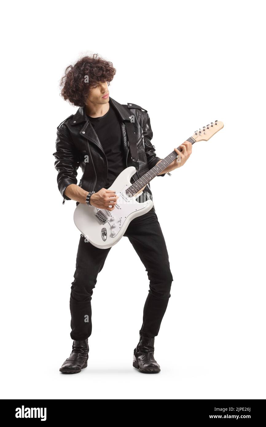 Full length shot of a man in a leather jacket playing an electric guitar isolated on white background Stock Photo