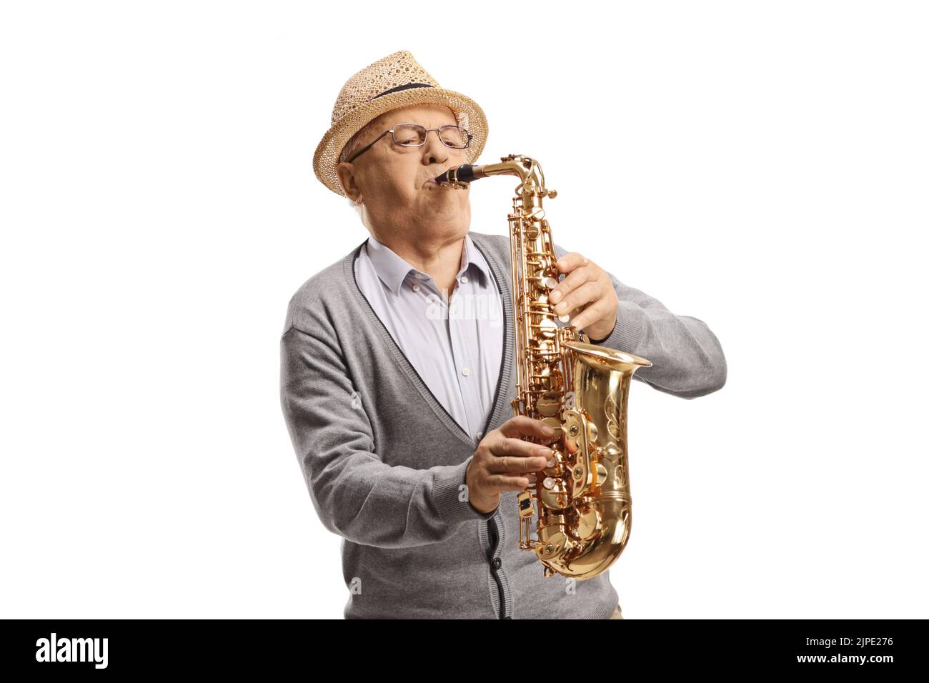 Senior male musician playing a saxophone isolated on white background Stock Photo
