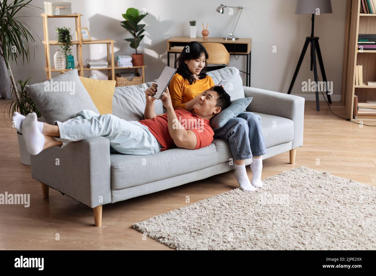 High angle view of beautiful chinese couple relaxing at home Stock Photo