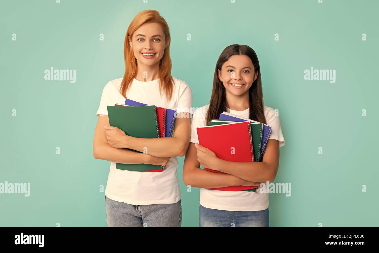 mom and teen girl study. private teacher and child holding copybooks ...